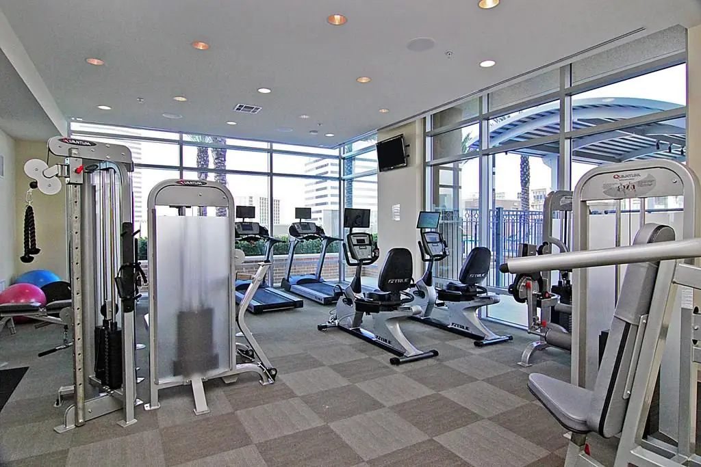 Highland Tower Fitness Center with premium equipment and floor-to-ceiling windows
